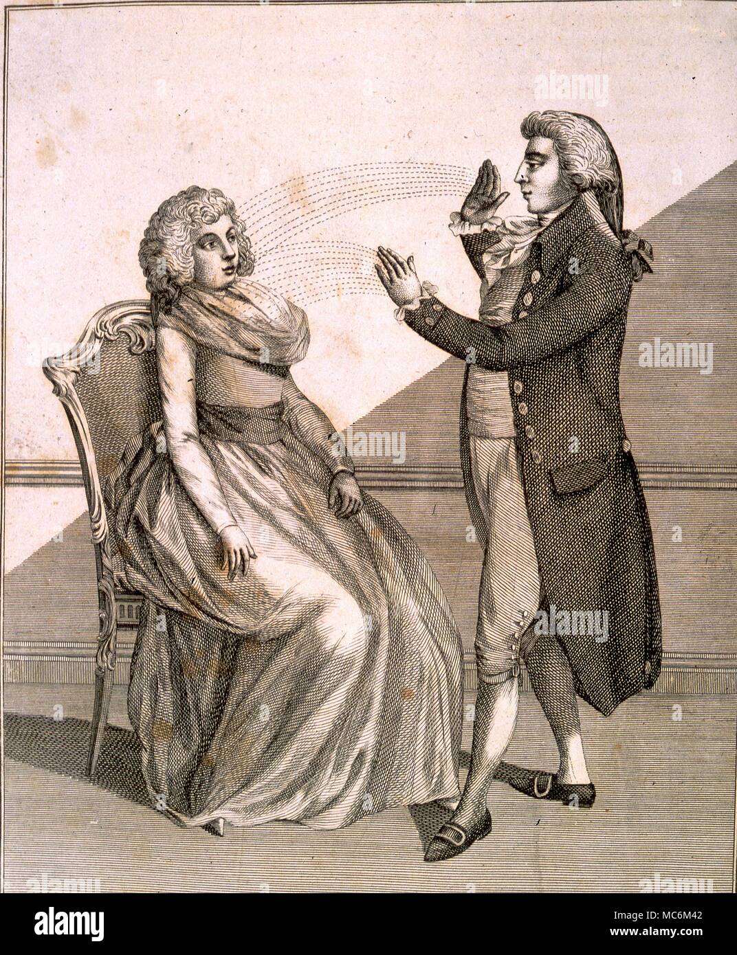 Hypnotism - Mesmerism late 18th century engraviing of a mesmerist influencing a woman with hand passes. From Ebenezer Sibly's A Key to Physics and the Occult Sciences 1794 Stock Photo