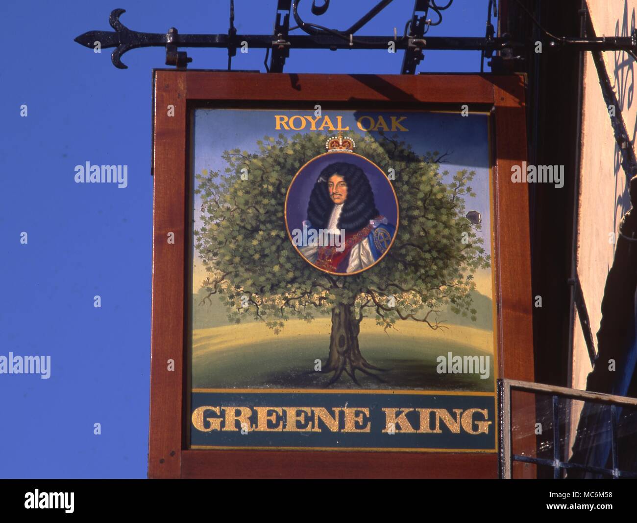Inn sign of The Royal Oak. Pub sign for one of the Greene King houses. Stock Photo
