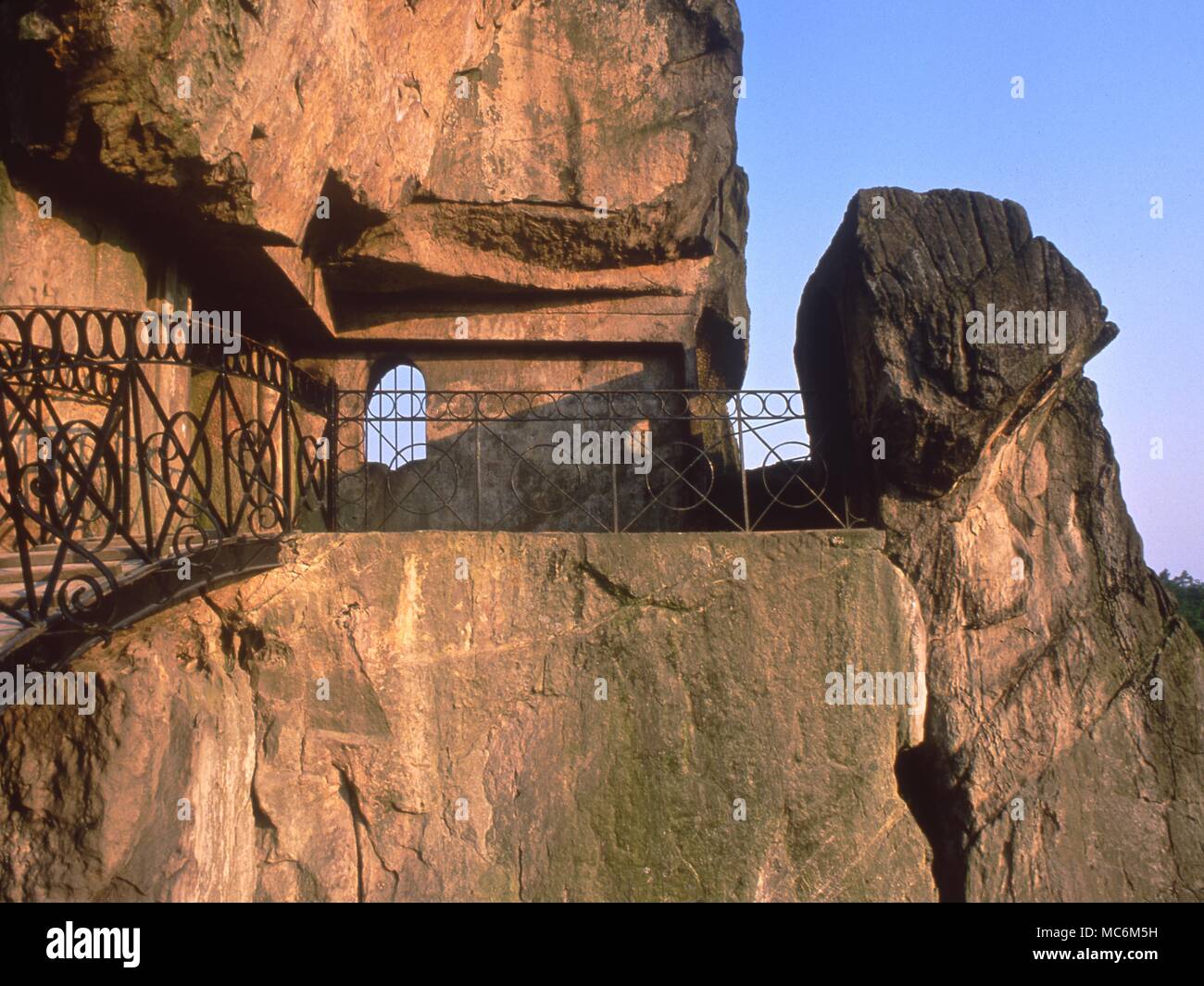 Light Mysteries. The upper chapel on the rocks at Externsteine. This has a porthole to allow a beam of light to fall on the Pagan altar at the solstice sunrise. Stock Photo