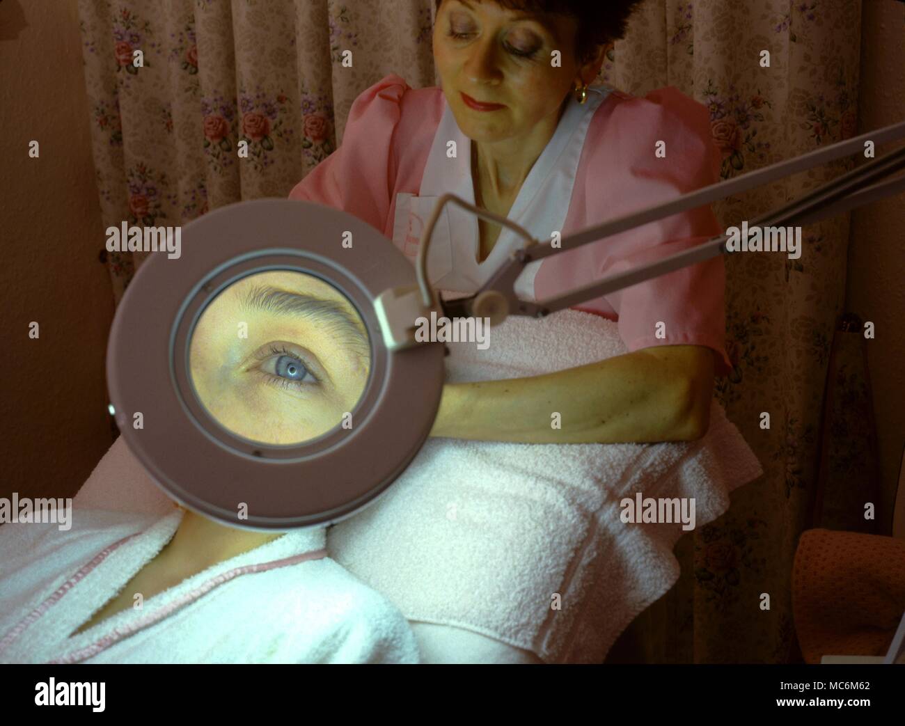Iridology. The eye seen through a salon magnification lamp. Stock Photo