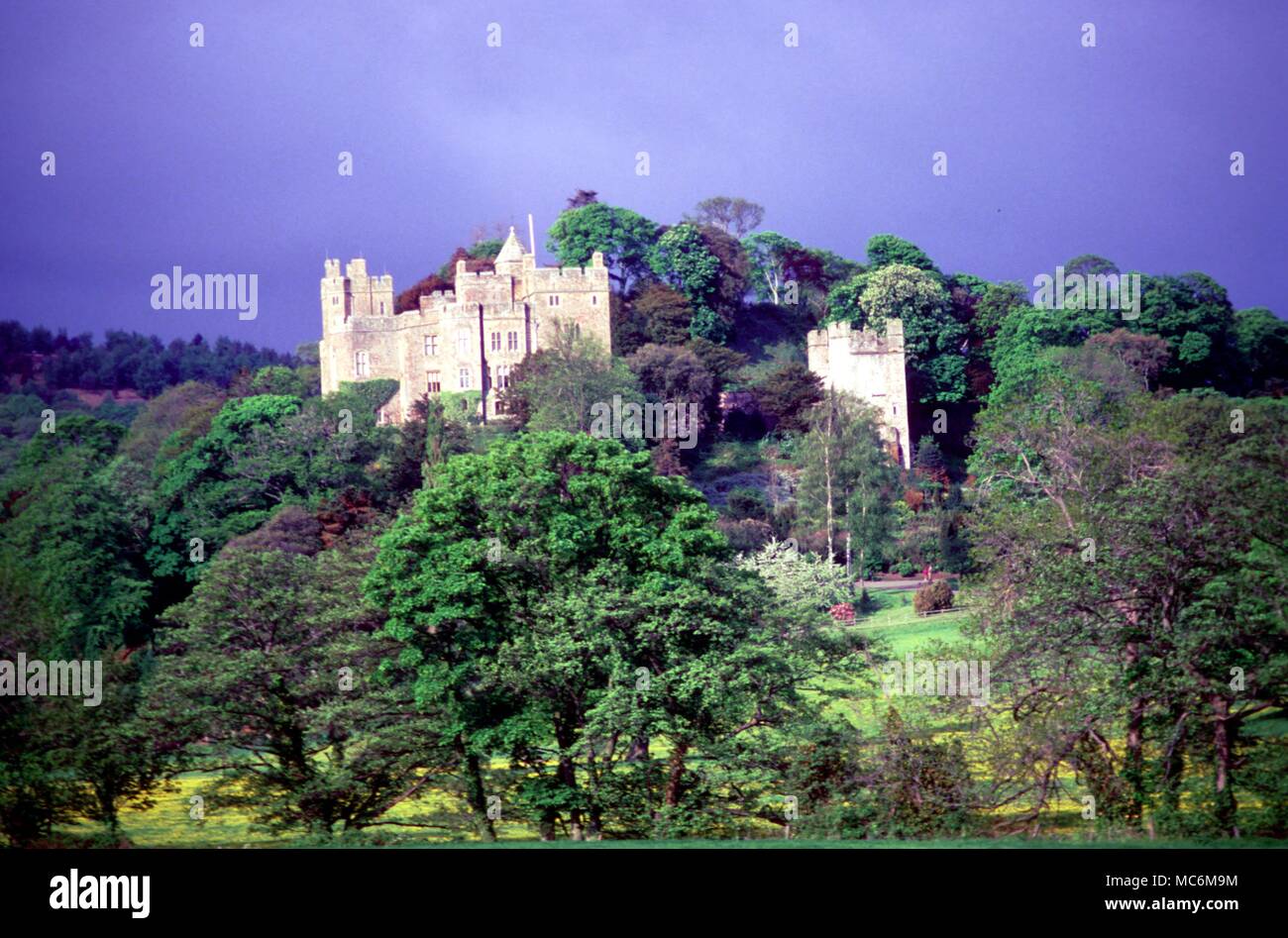 Haunted Places - Dunster Castle. Dunster Castle, founded in 1070, and continually inhabited ever since, mainly by the Luttrells. Linked with the legend of a local giant, and with several ghost stories. Stock Photo