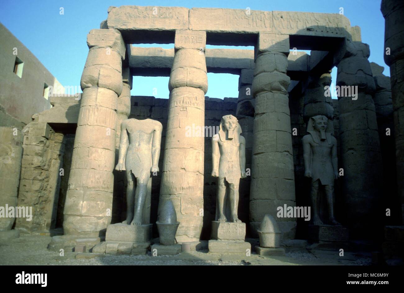 Egypt Luxor Courtyard in the Temple of Luxor with the remains of colossal statues of the Pharoah Rameses II Stock Photo
