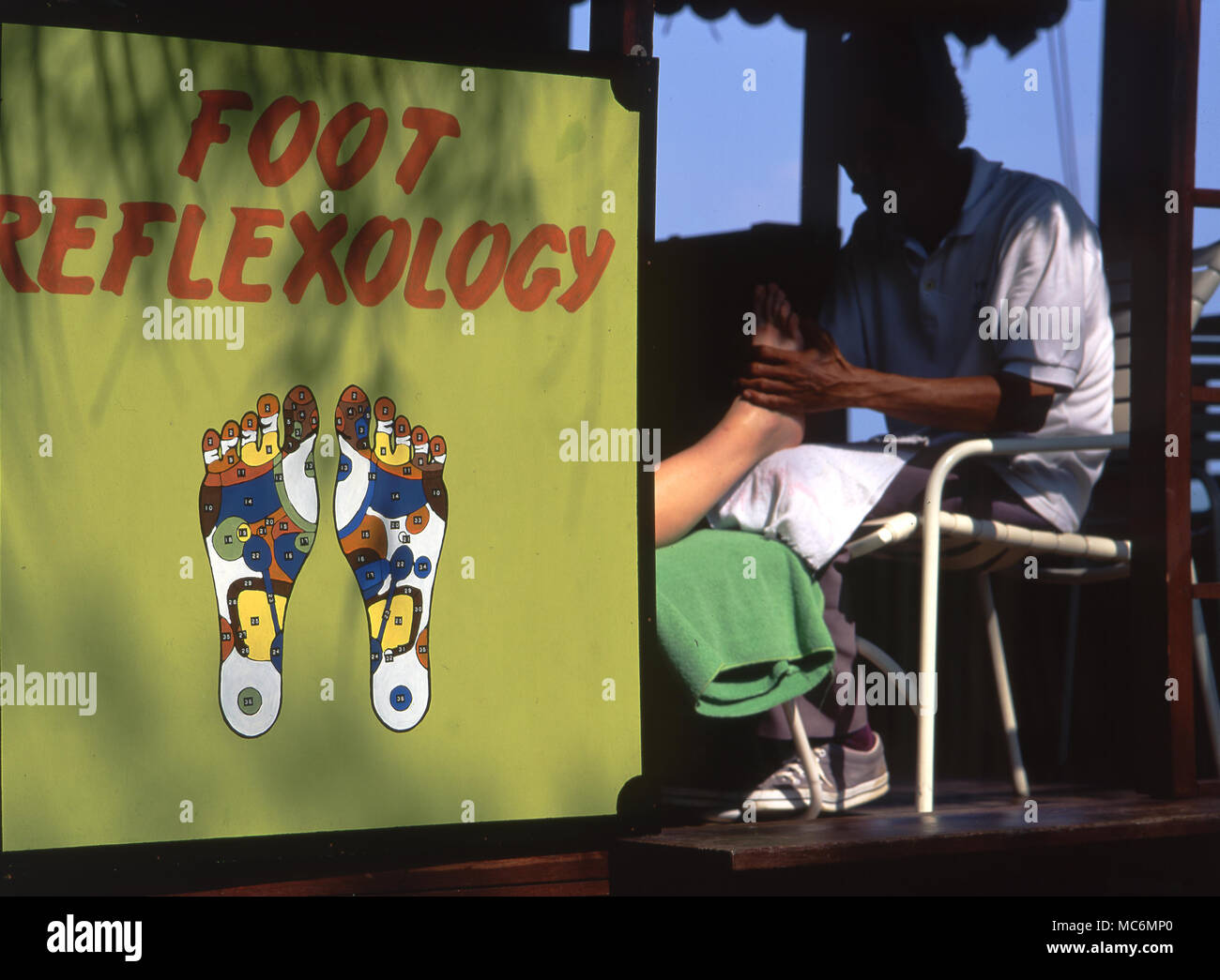 Foot massage or reflexology in the garden of a hotel in Penang