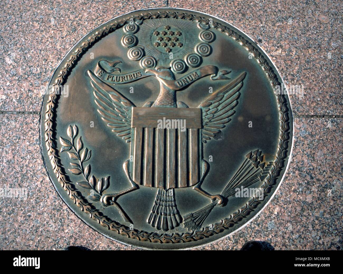 American History - Seal The obverse of the Seal of the United States of America (design of circa 1802). This bronze is set in the pavement of the Freedom Plaza, in Pennsylvania Avenue, Wahington DC. Stock Photo