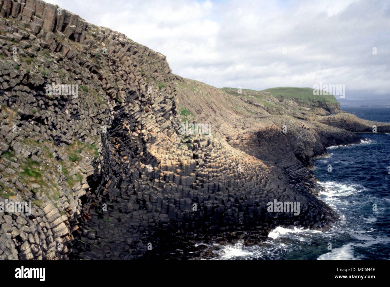 Staffa The hexagonal basaltic columns which form the cliffs of Staffa Island and which are often believed to have carved by giants or made by the ancient magicians Stock Photo