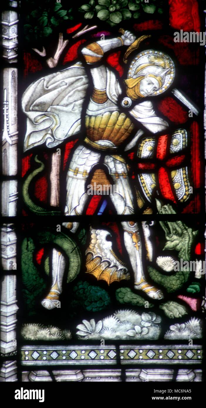 Dragons George and the Dragon stained glass window of St George killing the dragon in St Petroc's church Bodmin Stock Photo