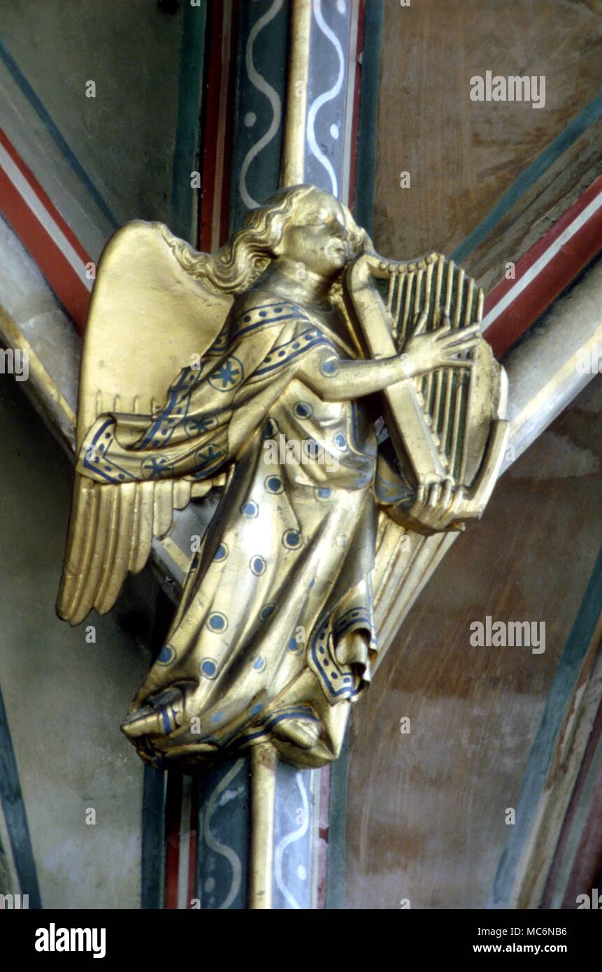 Angels Carved angel on the choir roof of Gloucester Cathedral Late mediaeval Stock Photo