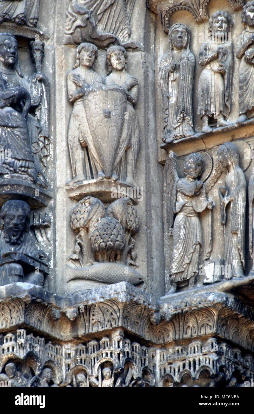 Ast. Sites Chartres Gemini the twins with a single fish for Pisces at their feet on the south door of the western facade of Chartres Cathedral 13th century Stock Photo