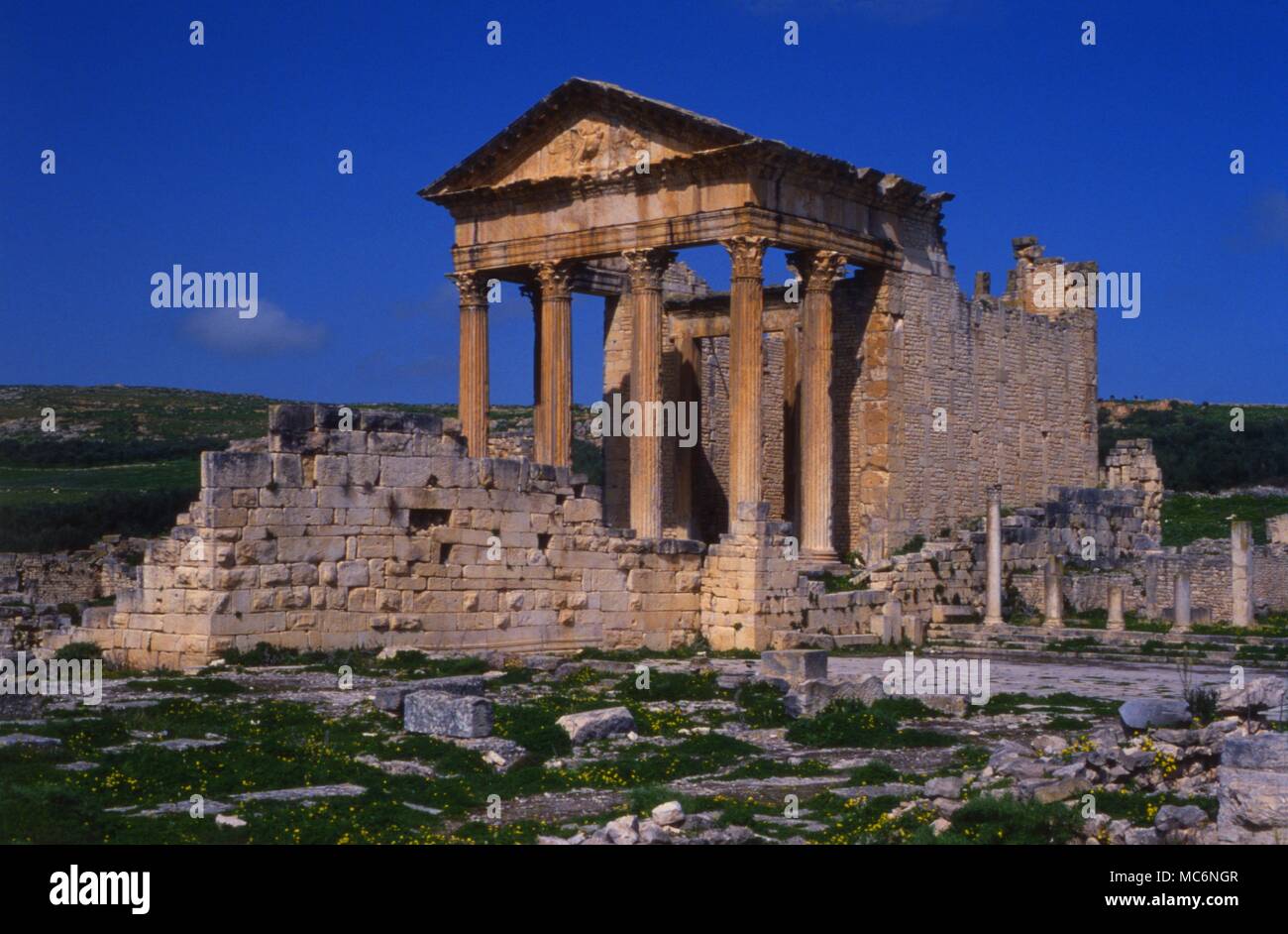 The ancient Roman Capitol in the city of Dougga, Tunisia. Stock Photo