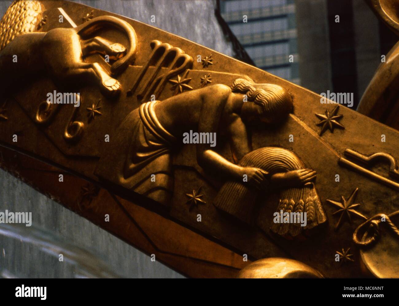 The Prometheus statue, in the lower plaza of the Rockefeller Centre, New York, was sculpted by Paul Manship. The sigil and image for Virgo is visible in the detail. Stock Photo