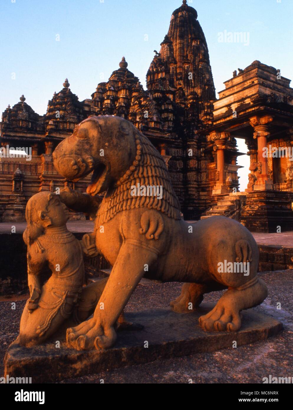 Stylized man and lion in front of the temple. Stock Photo