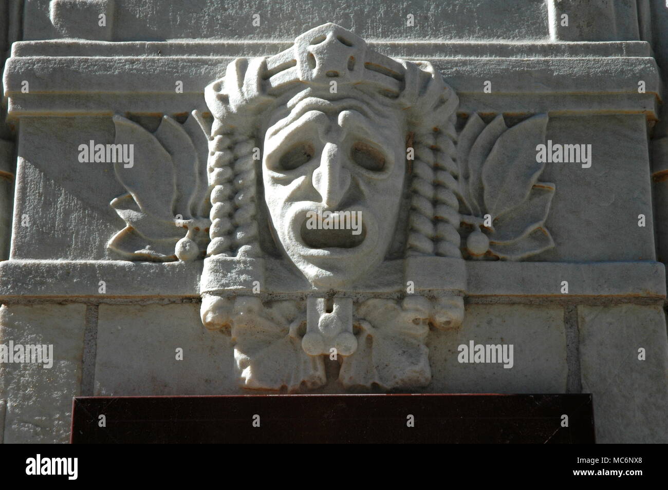 Dramatic mask representing Tragedy on the facade of the National Theatre, Stockholm. Stock Photo