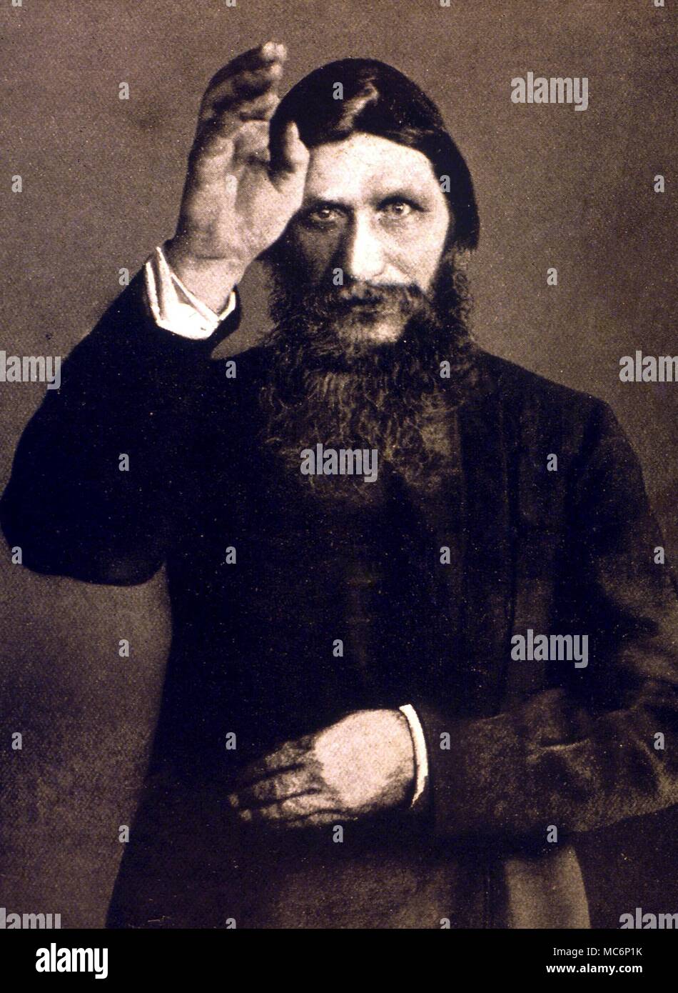 Grigori Yefimovich Rasputin (1871-1916). Rasputin posing in the attitude of blessing his women disciples Stock Photo