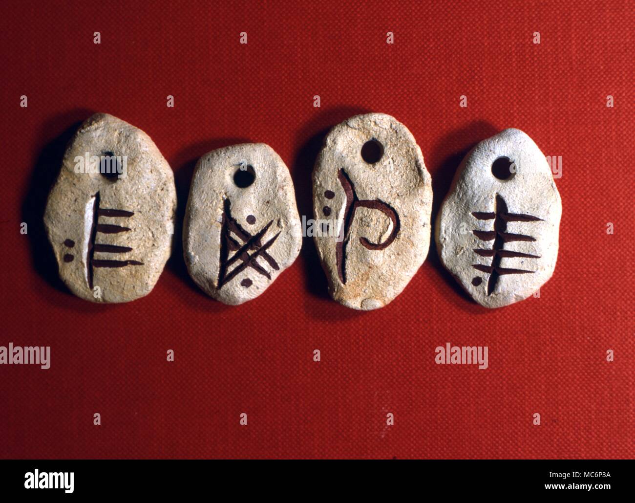 Celtic Ogham Stones, used in divination and alphabets. Left to right: February - S - Willow; Fire - PE - honeysuckle; Earth - PH - beech; Water - E - poplar. 2004 Charles Walker / Stock Photo