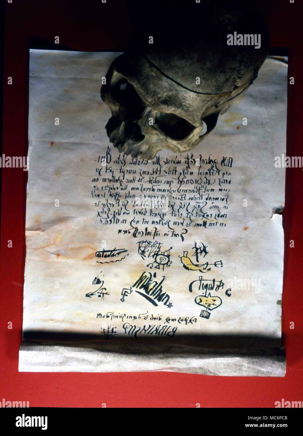 A pact, written in reversed Latin, supposedly constructed by the demons on behalf of the priest, Father Urbain Grandier, who was burned alive at Loudun [France] in 1634. It is known that the pact was forged by his accusers. Among the several demonic signatures [and sigils] is that of Beelzebub. Stock Photo