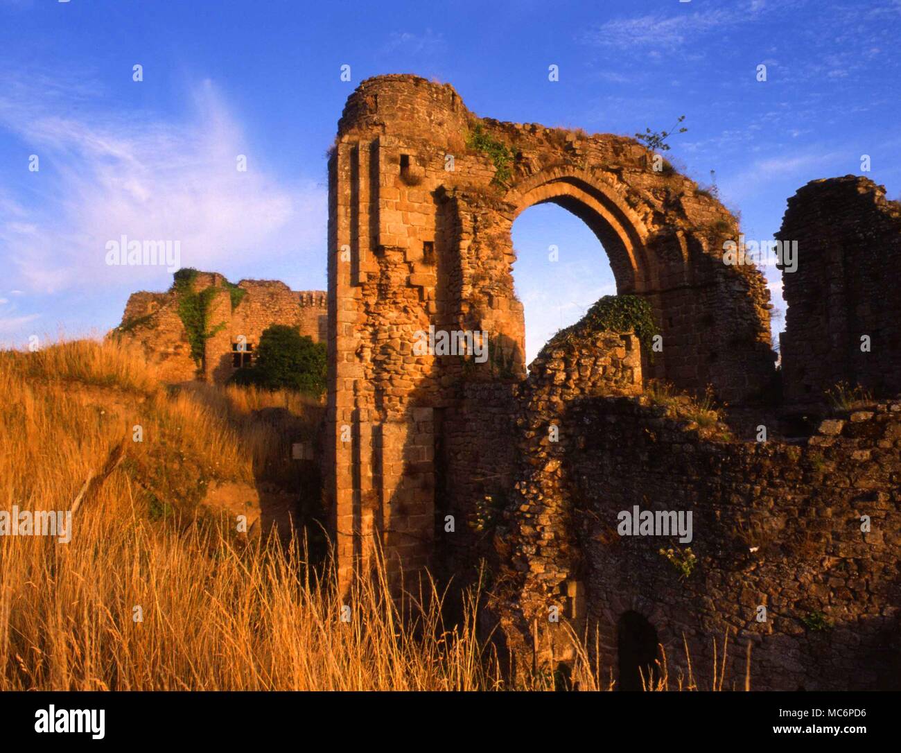 The ruins at Tiffauges, the most important of the casltes belong to Gilles de Rais [1404-1440], where he was supposed to have practised black magic, and to have killed numerous children in his pursuit of witchraft rites. Stock Photo