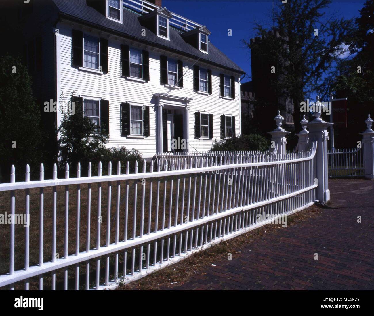 Seventeenth century house and Salem First Church - the hub of the witchcraft mania of the seventeenth century, in Salem, Massachusetts. Stock Photo