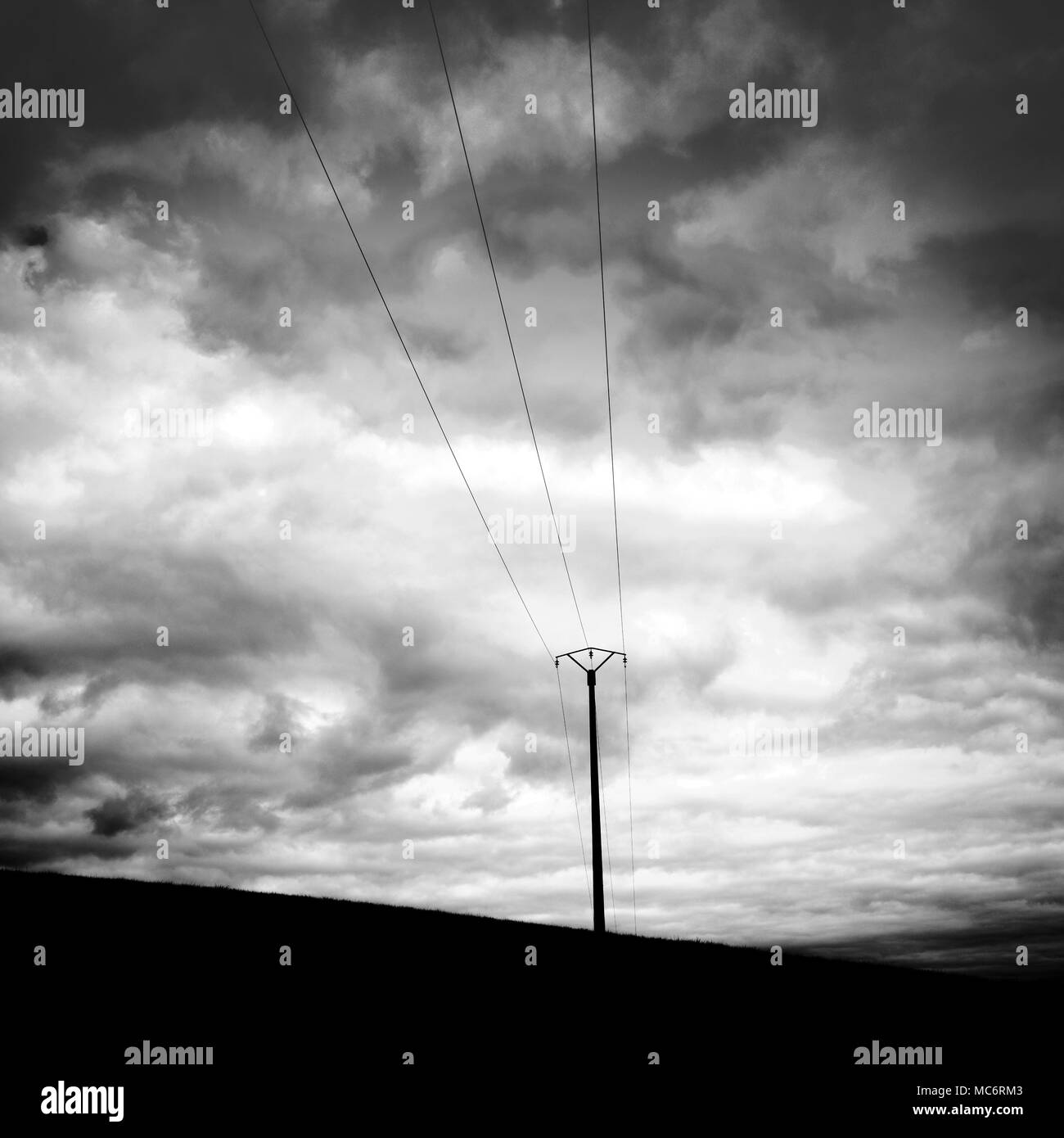 Electric pylon in nature and cloudy sky. France Stock Photo - Alamy