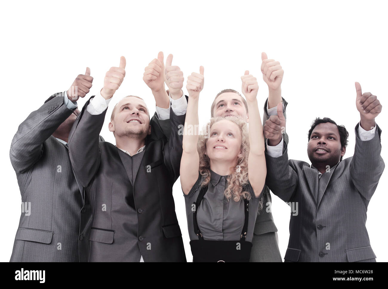 closeup.international business team showing thumbs up Stock Photo - Alamy