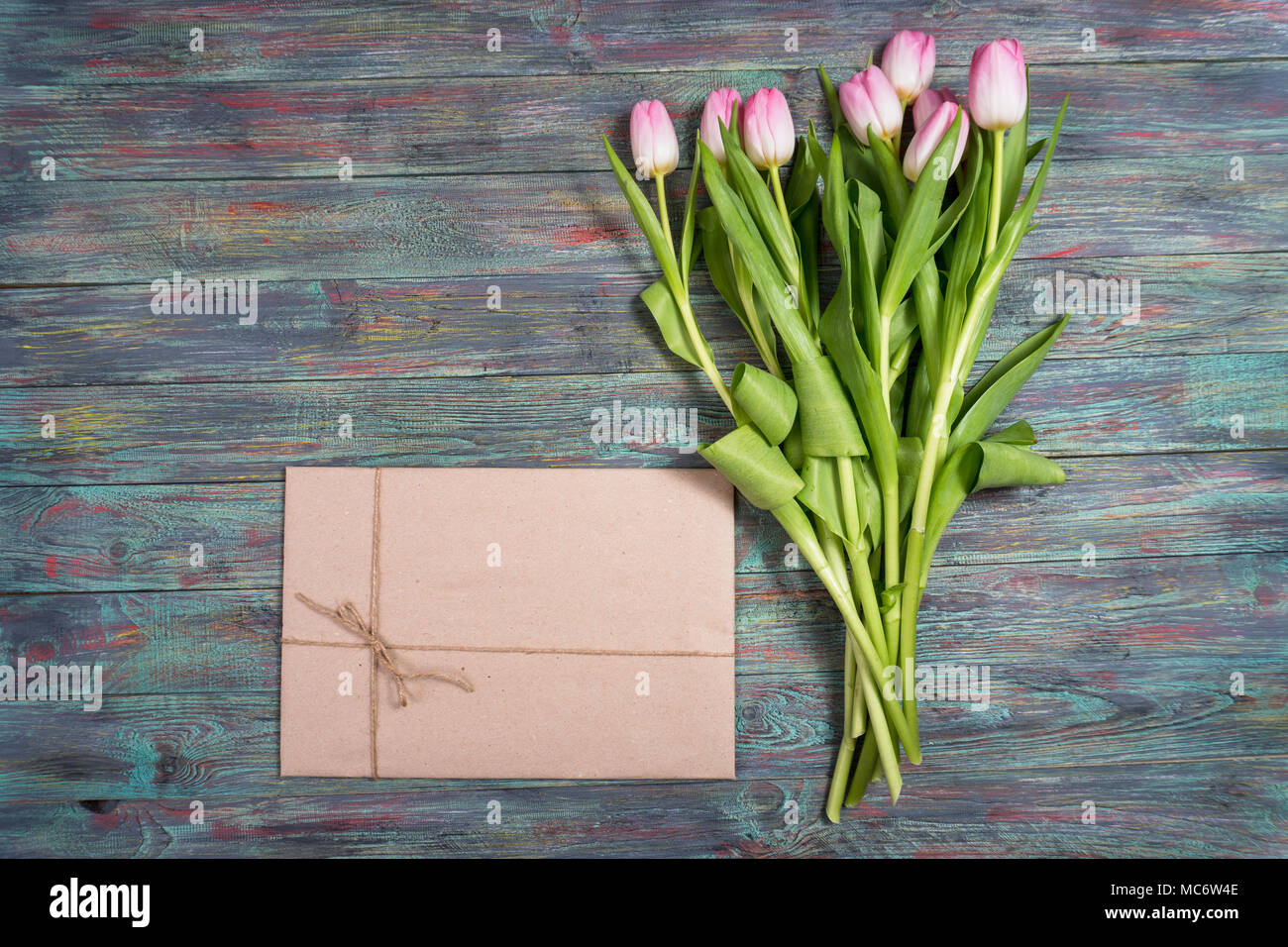 Pink Tulips Flowers With Gifts Boxes On Wooden Background