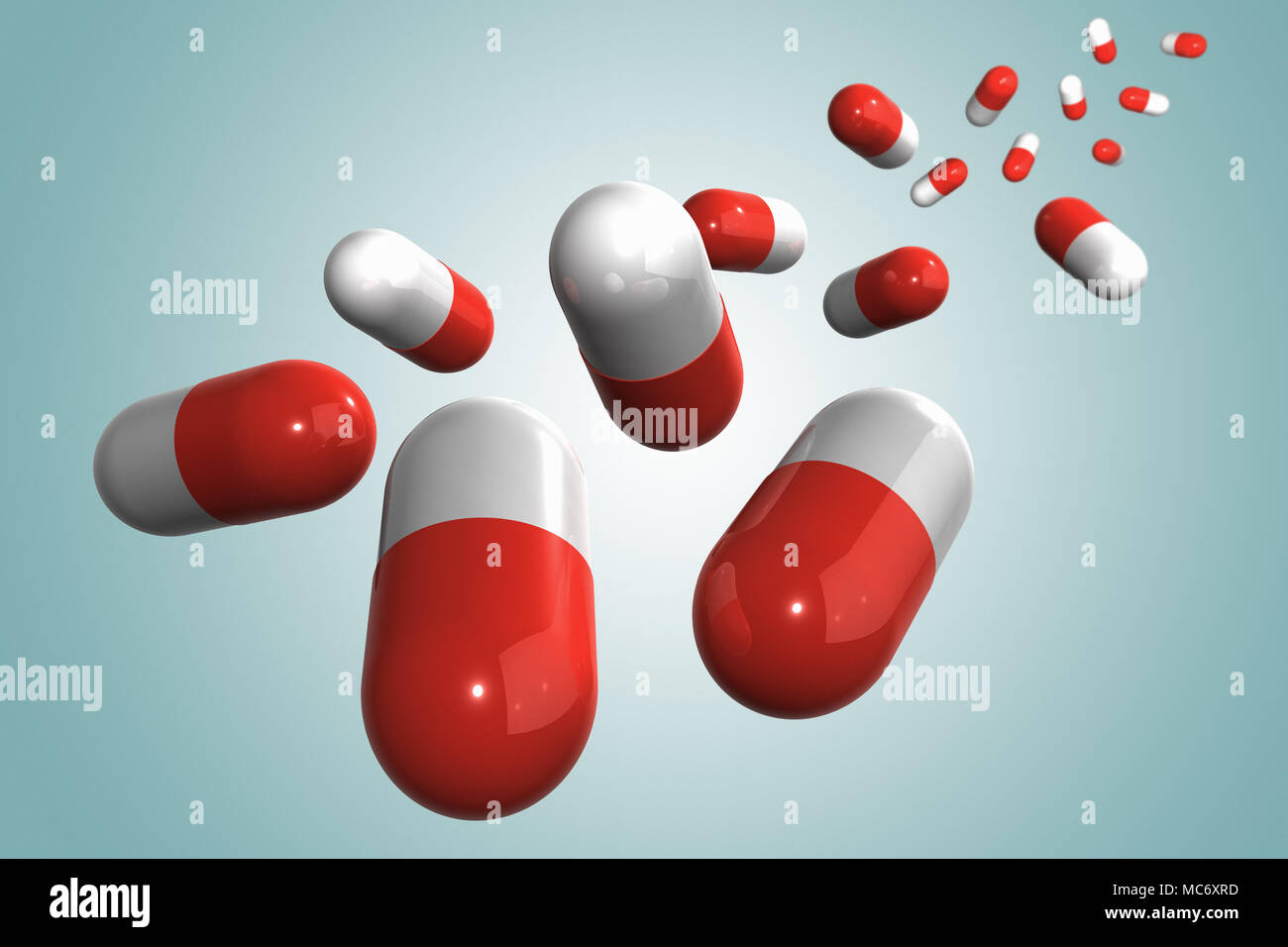 3D rendering of a bunch of medicine capsules against a blue background Stock Photo