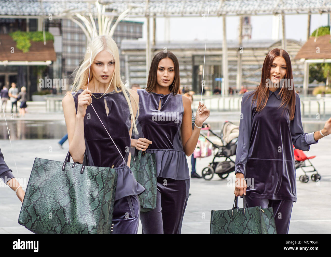 MILAN, ITALY - SEPTEMBER 22, 2017: Fashionable models poses on the street at fashion show building during Milan Women Fashion Week. Stock Photo