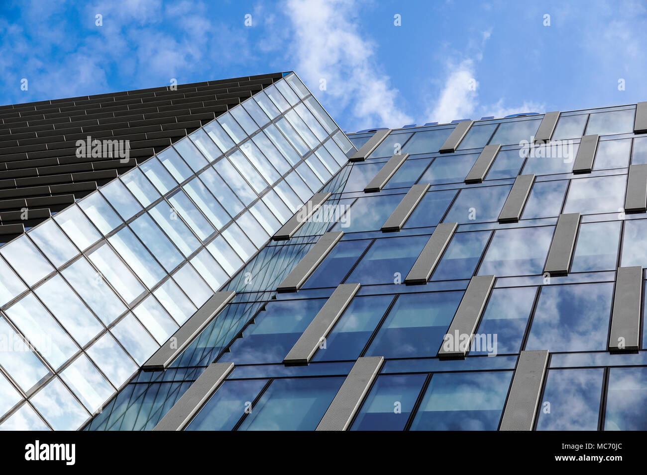 modern blue glass wall of office building Stock Photo - Alamy
