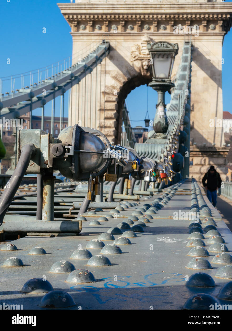 Chain Bridge over the Danube in Budapest, Hungary with some padlocks in focus Stock Photo