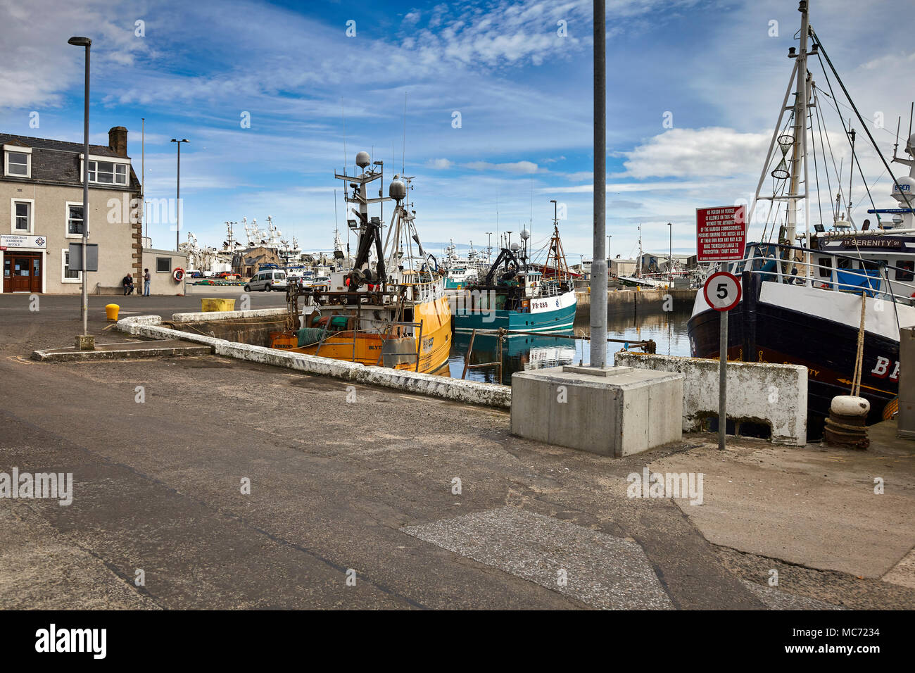 A collection of fishing craft moored up at Fraserburgh Harbour Stock Photo