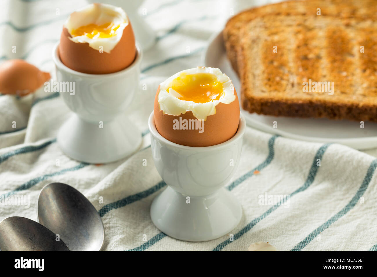 Homemade Soft Boiled Egg in a Cup with Toast Stock Photo - Alamy