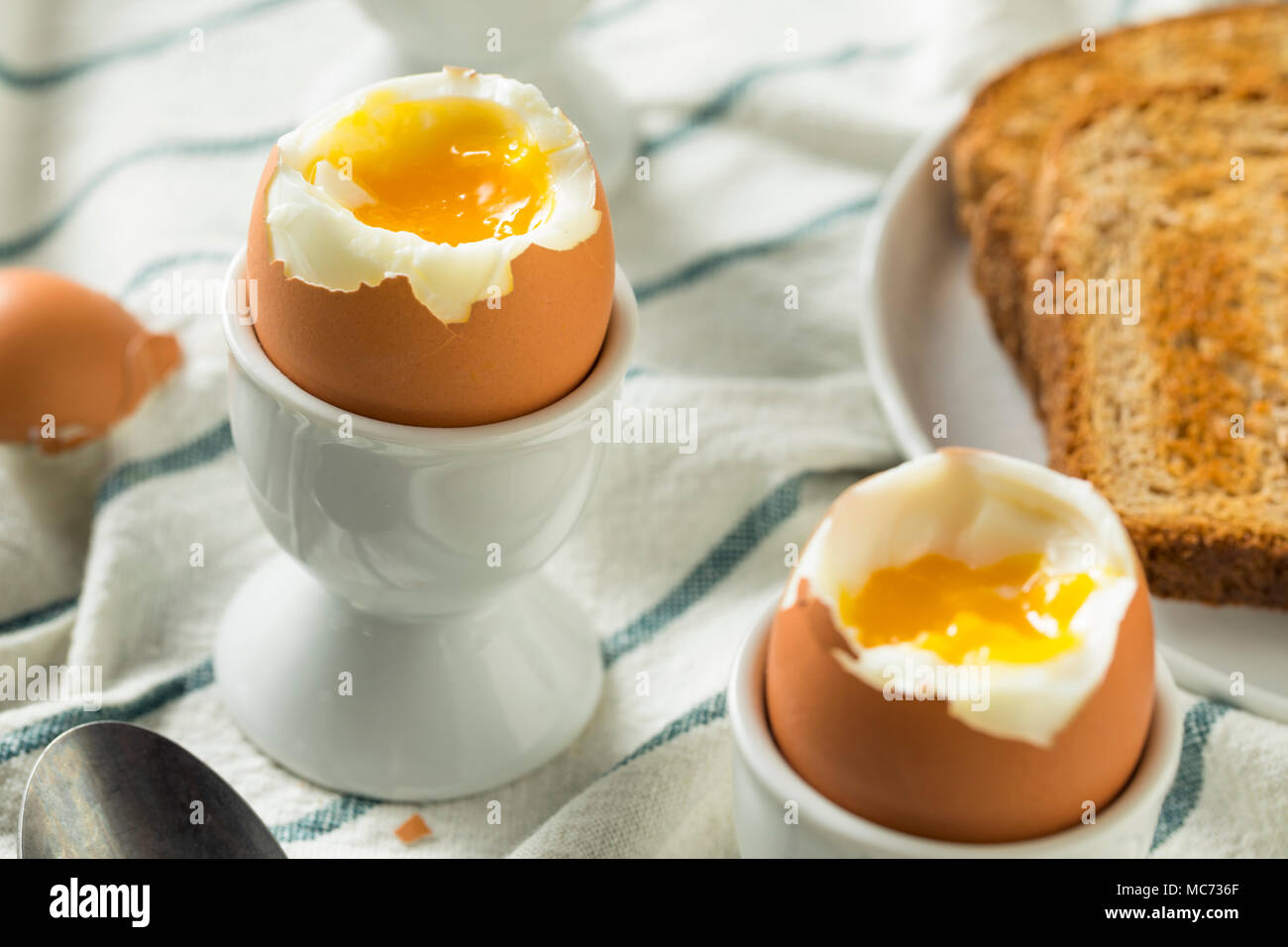 Homemade Soft Boiled Egg in a Cup with Toast Stock Photo