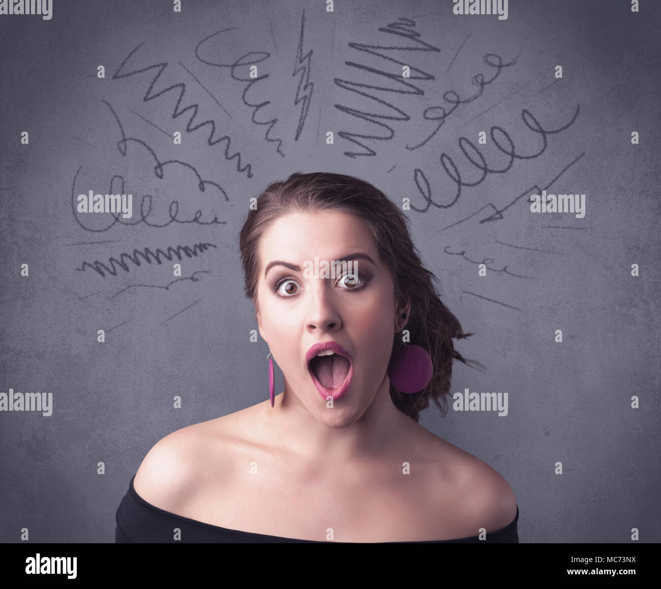 A cute female student making funny face expressions with pressure and ...