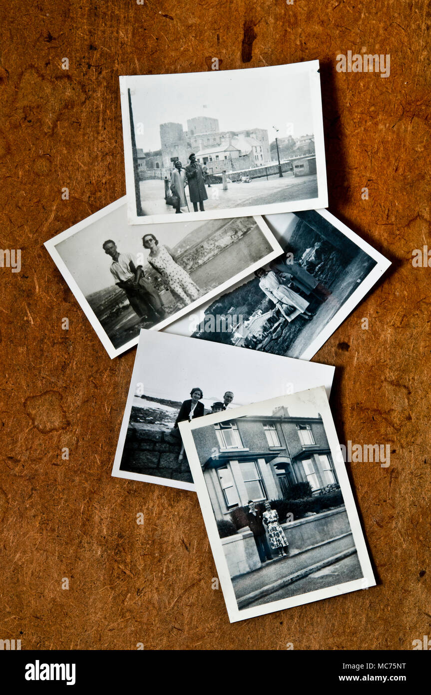 old photographs from the seventies scattered on a table, nostalgia and