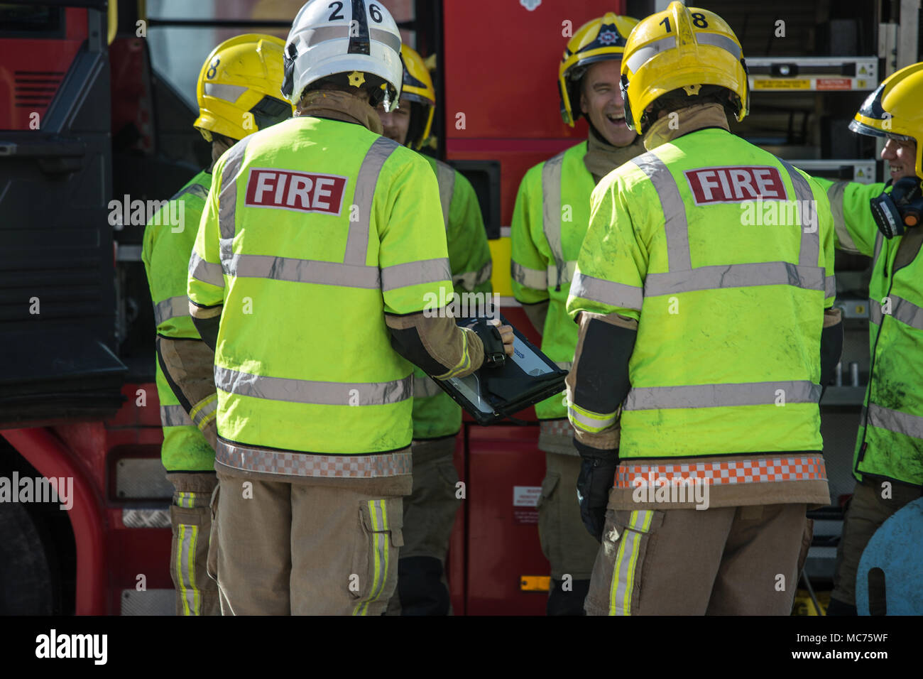 Group of firemen uk by engine hires stock photography and images Alamy