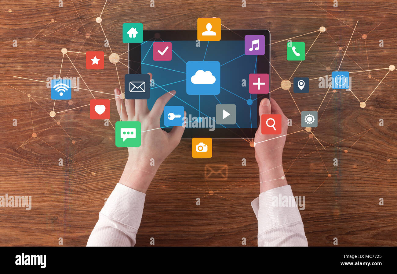 Hand touching multitask tablet with cloud wifi message social media ...