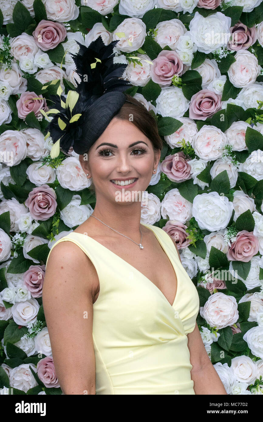 Racegoers female fashions, high-fashion clothing, stylish, geek chic trendy, formal ladies frocks, haute couture dresses and fashionistas at the Randox Health Grand National, Aintree, Liverpool, Merseyside. April 2018.  The most famous event in the horse racing calendar welcomes people on this very special parade of Ladies outfits & the finest female fashions.  Racegoers have been urged to 'smarten up' to make the event more ‘aspirational’ as thousands of glamorous women pour through the entry gates on the one and only 'Grand National' as up to 90,000 visitors are expected to attend the Stock Photo