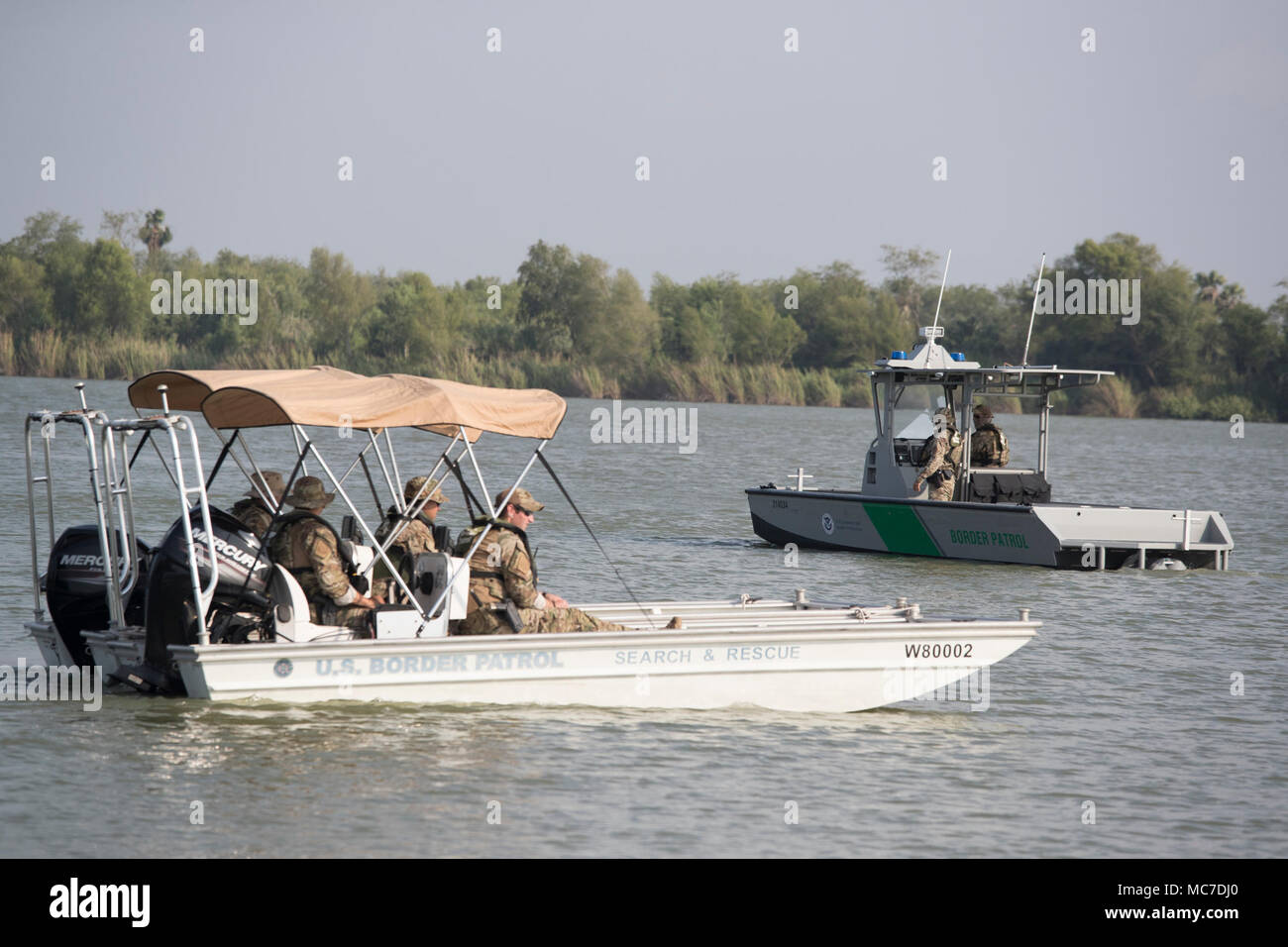 U.S. Border Patrol agents on surveillance duty on the Rio Grande River ...