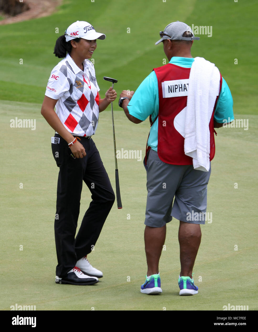 April 11 18 Benyapa Niphatsophon Hand The Putter To Her Caddy On The 4th Green During The First Round Of The Lpga Lotte Championship At The Ko Olina Golf Club In April 11 18 Benyapa Niphatsophon Hand The Putter To Her Caddy On The 4th Green During The First Round Of The Lpga Lotte Championship At The Ko Olina Golf Club In