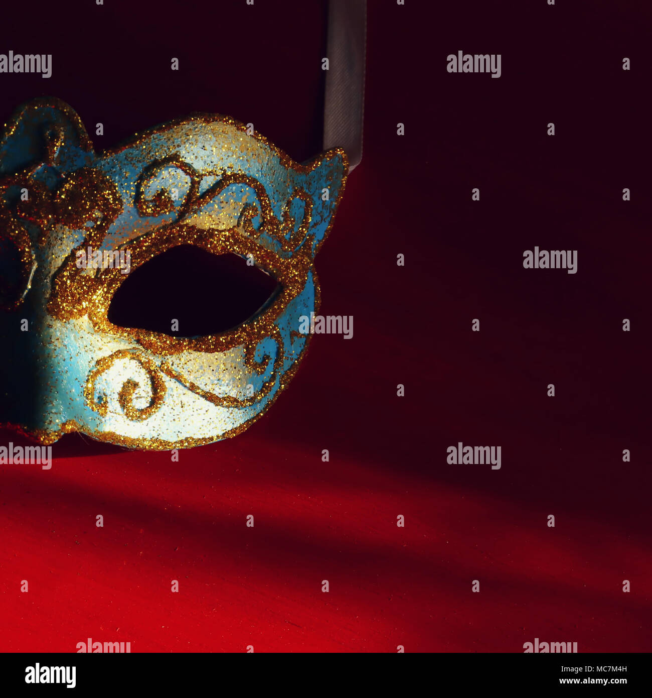 Image of elegant blue and gold venetian mask over red background Stock ...