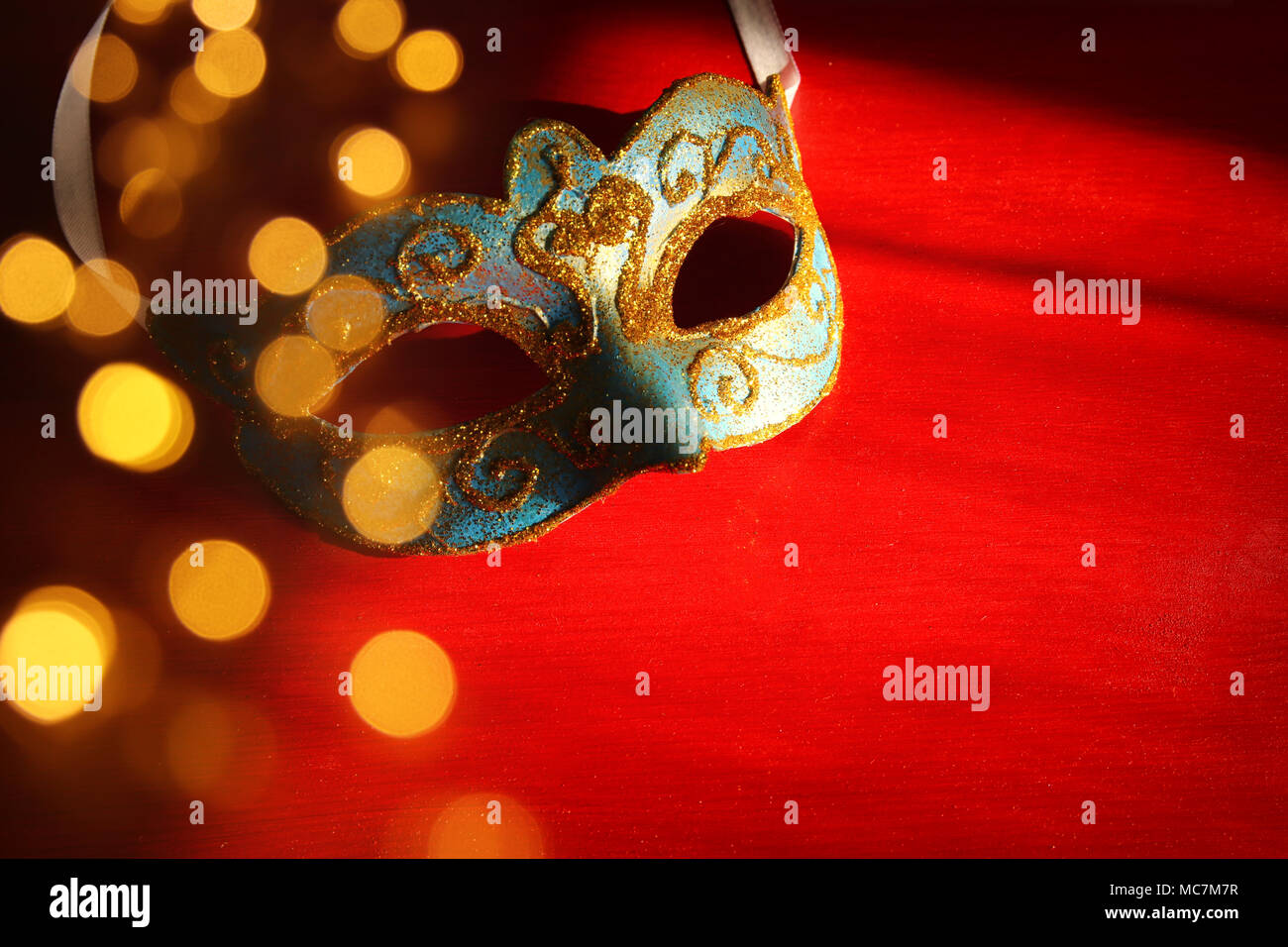 Image of elegant blue and gold venetian mask over red background Stock ...