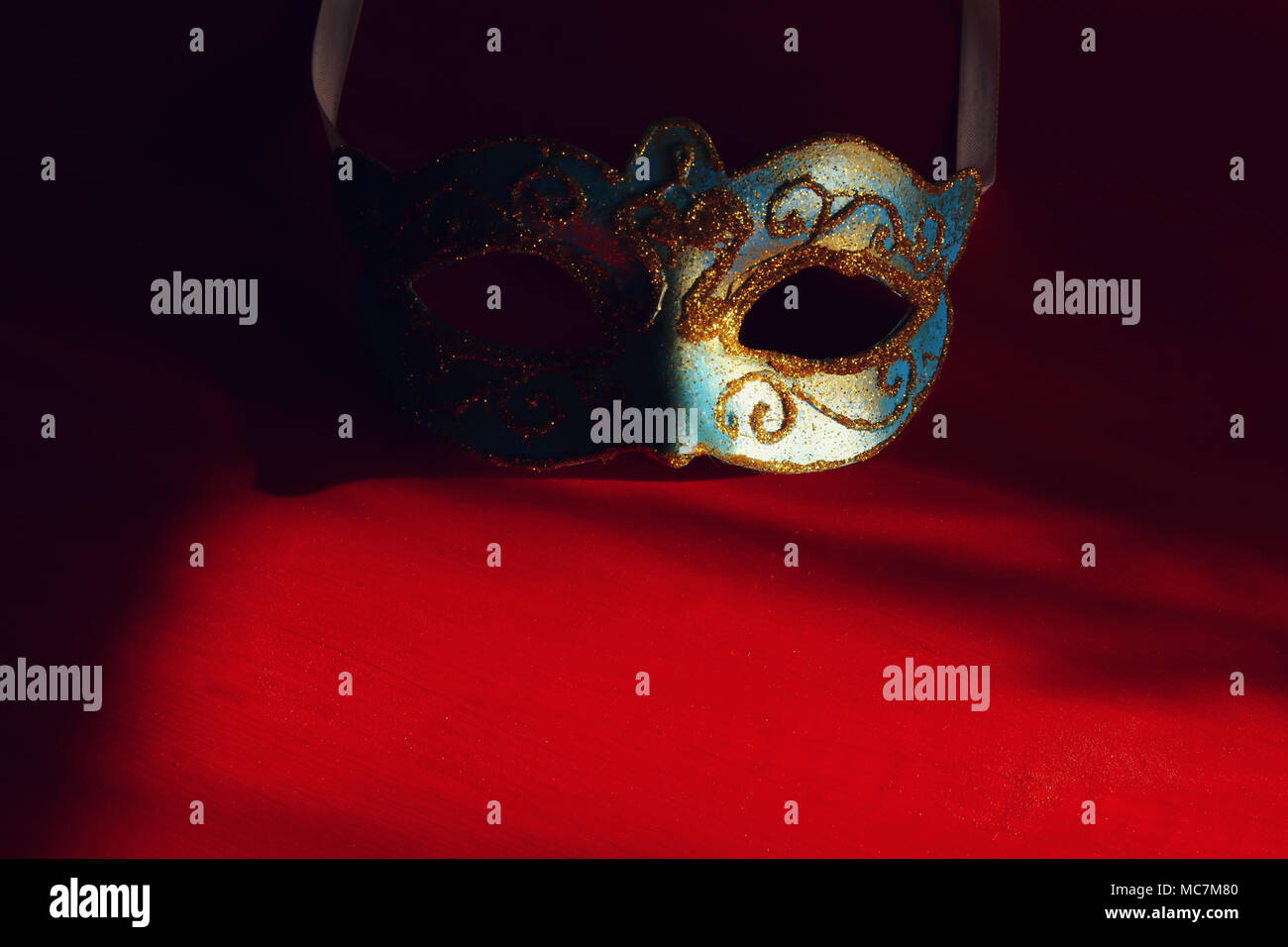 Image of elegant blue and gold venetian mask over red background Stock ...