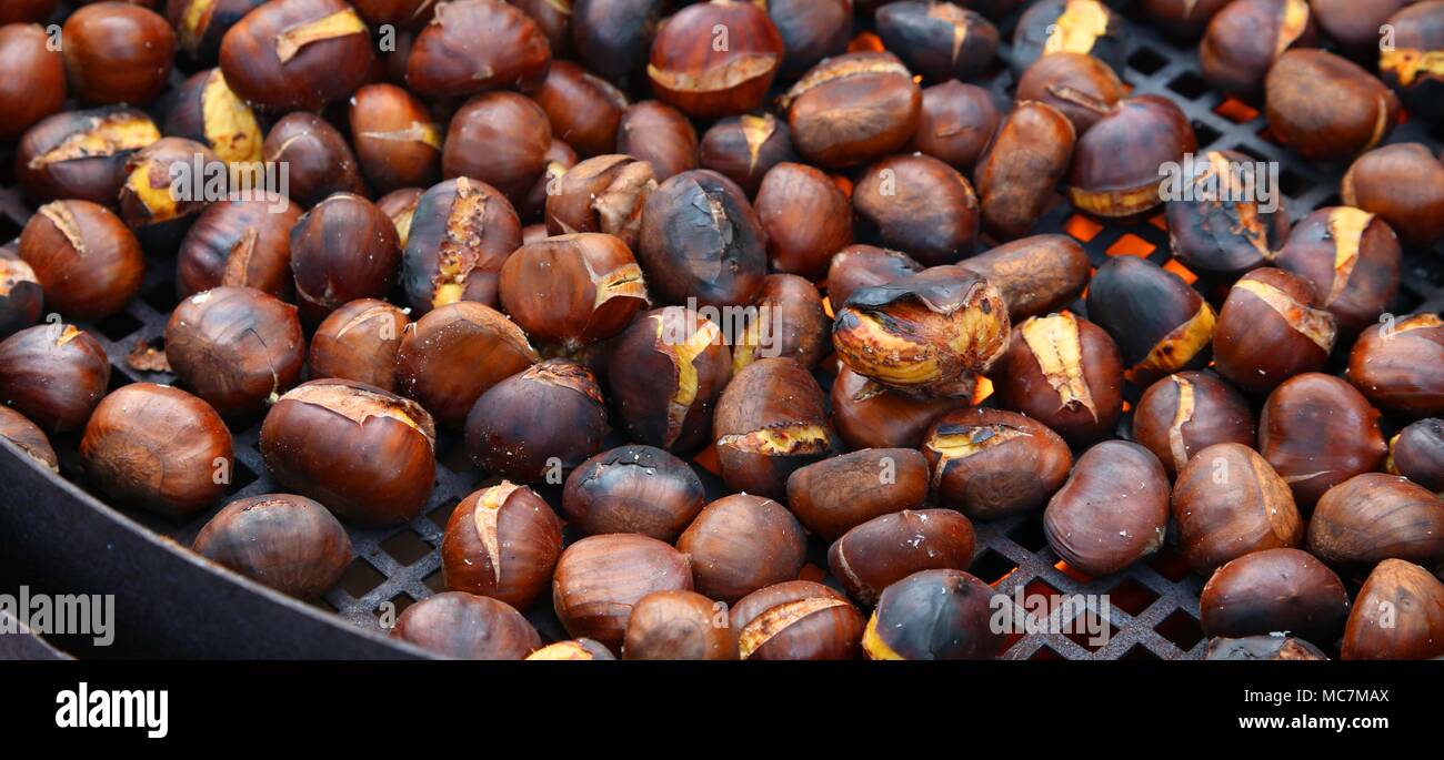 roast chestnuts cooked over the red-hot grill Stock Photo - Alamy