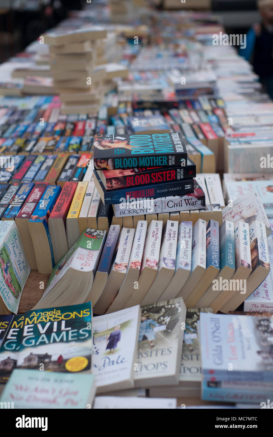 Bookstall in a market square selling paperback novels Stock Photo