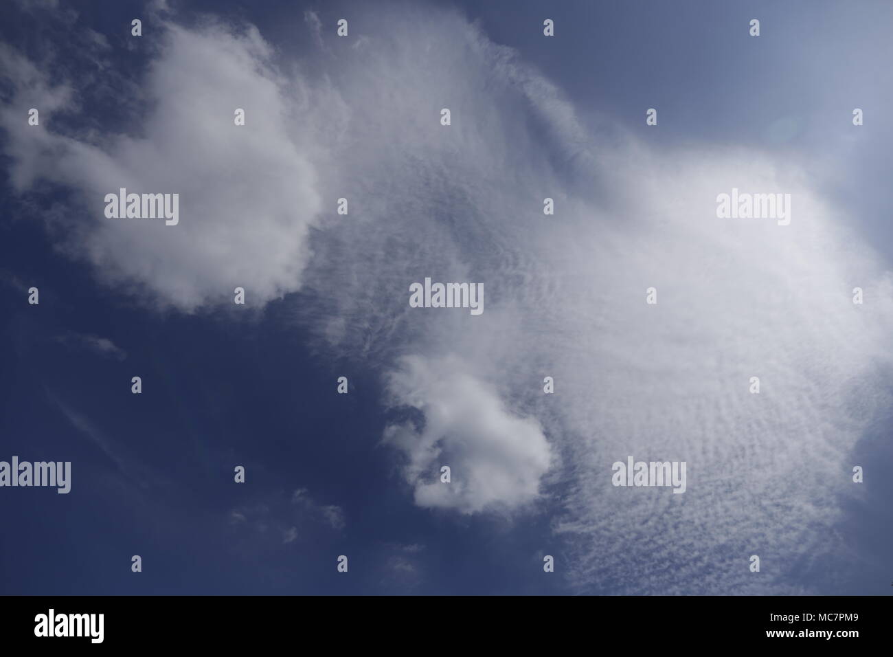 Clouds in the sky in many shapes Stock Photo - Alamy