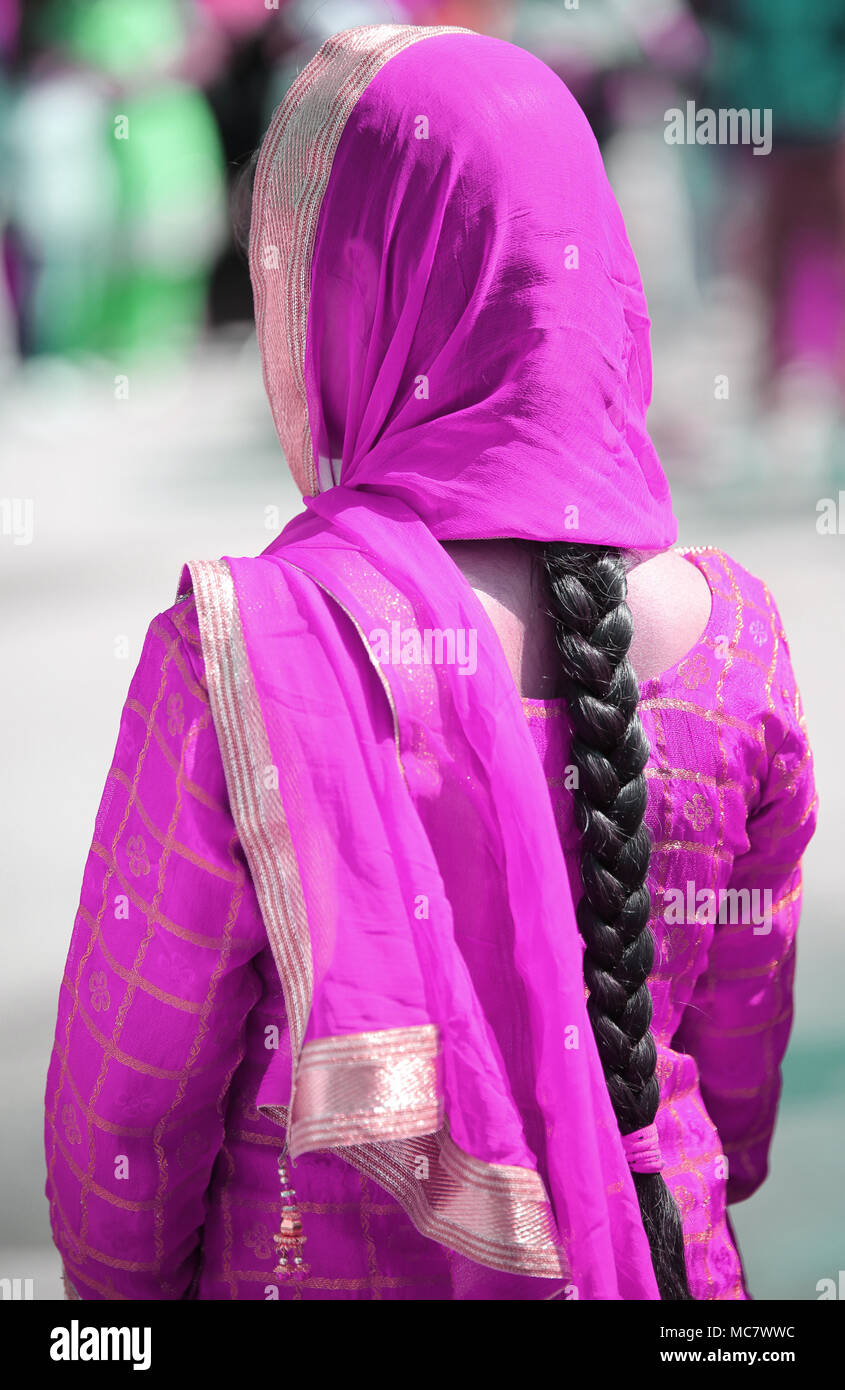 Indian Woman With Purple Dress And Long Black Hair Stock Photo