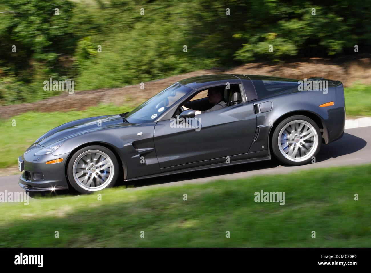 Grey Chevrolet Corvette ZR1 driving fast Stock Photo Alamy