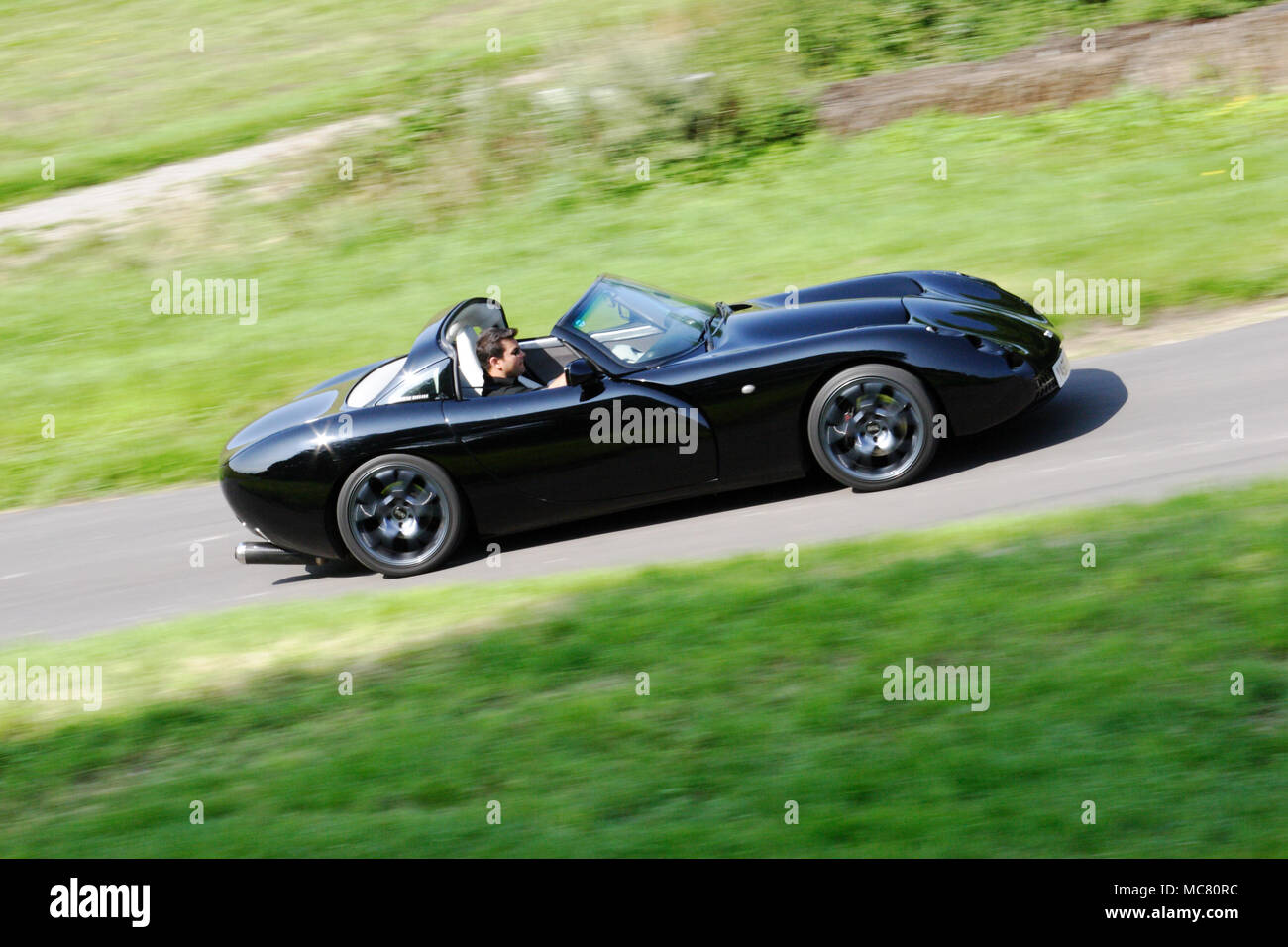 Black TVR Tuscan driving fast Stock Photo