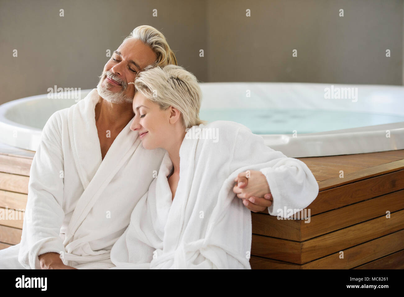 Couple in bathrobes relaxing at spa Stock Photo Alamy