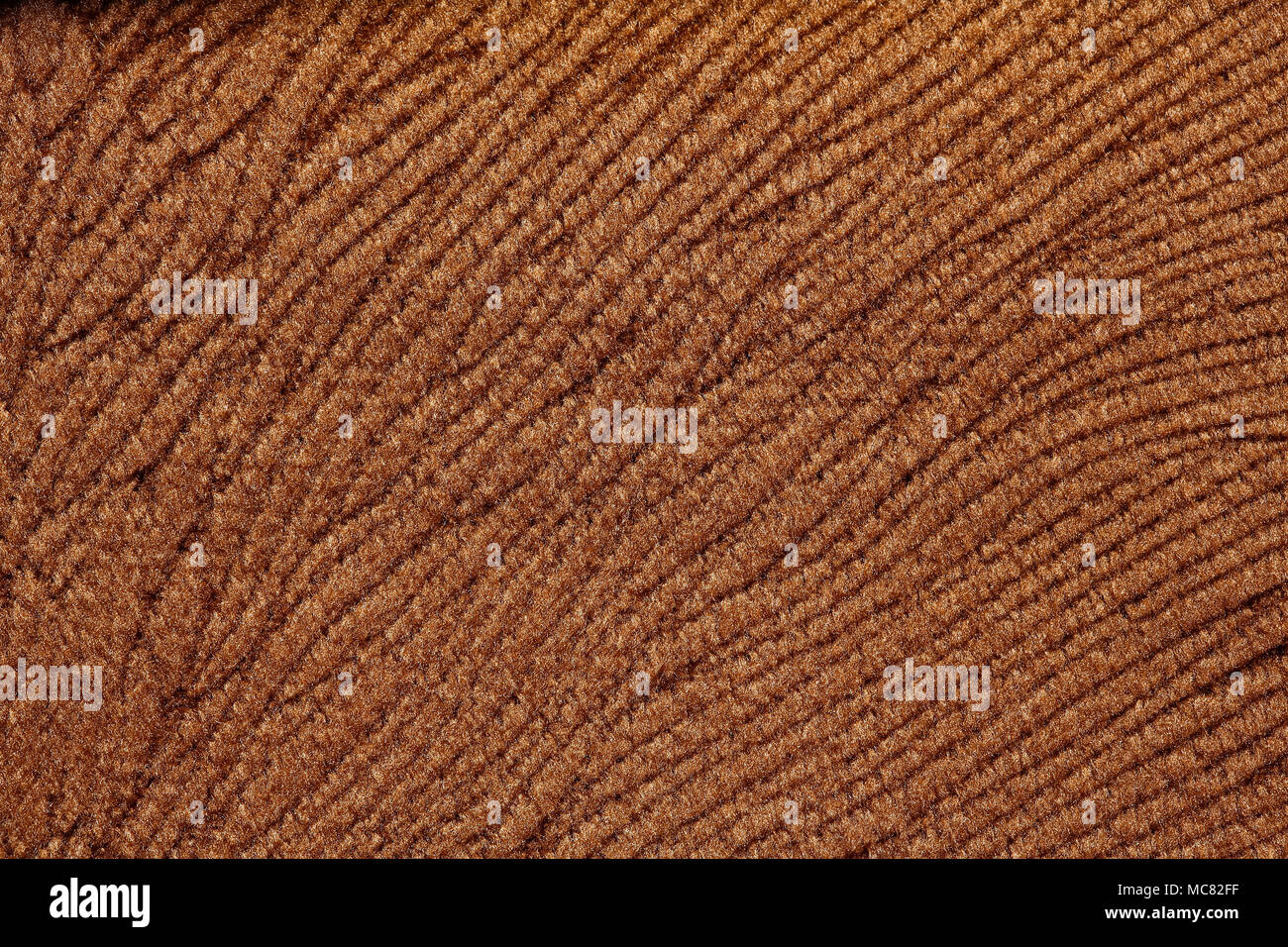 Contrast relief textile background in chocolate tone. Stock Photo