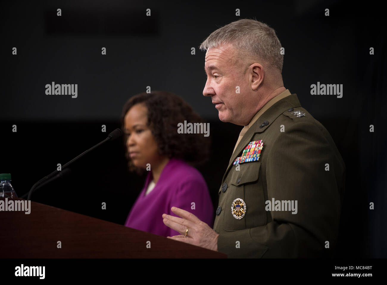 Dana White, the assistant to the secretary of defense for public affairs, and Lt. Gen. Kenneth F. McKenzie, the Joint Staff director, brief the press regarding American operations in Syria at the Pentagon in Washington, D.C., April 14, 2018. (DoD photo by Tech Sgt. Vernon Young Jr.) Stock Photo